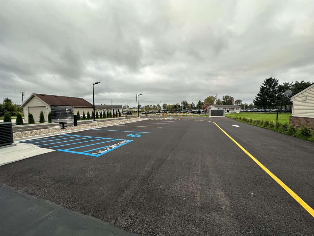 Frost heave-induced surface cracking on Mound Road, highlighting subgrade challenges.