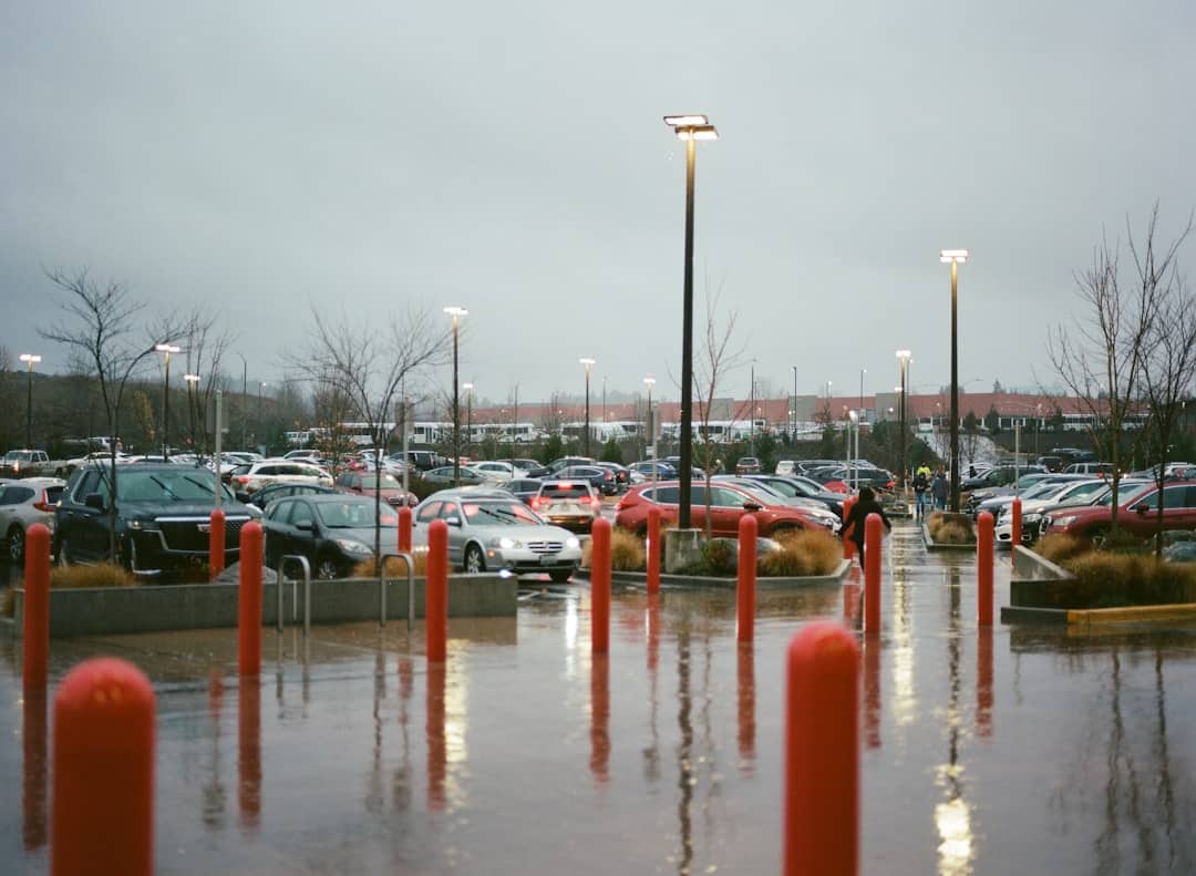 a parking lot filled with lots of parked cars