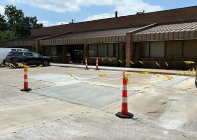Morelli – Clinton Township, Michigan 40 Paved patch in a concrete parking lot with traffic cones and caution tape