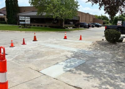 Morelli – Clinton Township, Michigan 38 Paved parking area in front of a commercial building with striped awnings