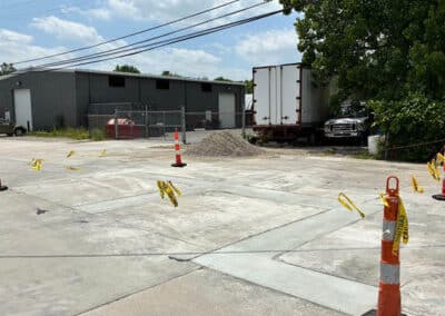Morelli – Clinton Township, Michigan 35 Concrete industrial lot sectioned off with traffic cones and caution tape