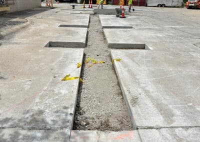 Morelli – Clinton Township, Michigan 25 Construction work on a street with a central trench and concrete edge channels
