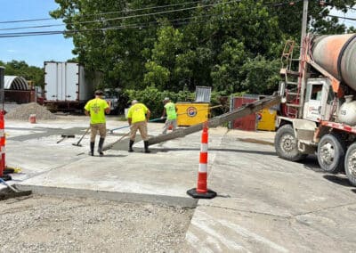 Morelli – Clinton Township, Michigan 24 Workers pouring concrete for a slab at a construction site